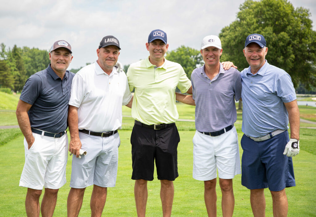Group photo of Brad Stevens with his golf teammates on a golf course at the Joel Cornette Foundation 2022 Annual Golf Outing