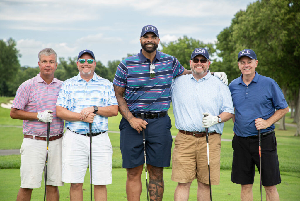 Group photo of Carlos Boozer with his golf teammates on a golf course at the Joel Cornette Foundation 2022 Annual Golf Outing